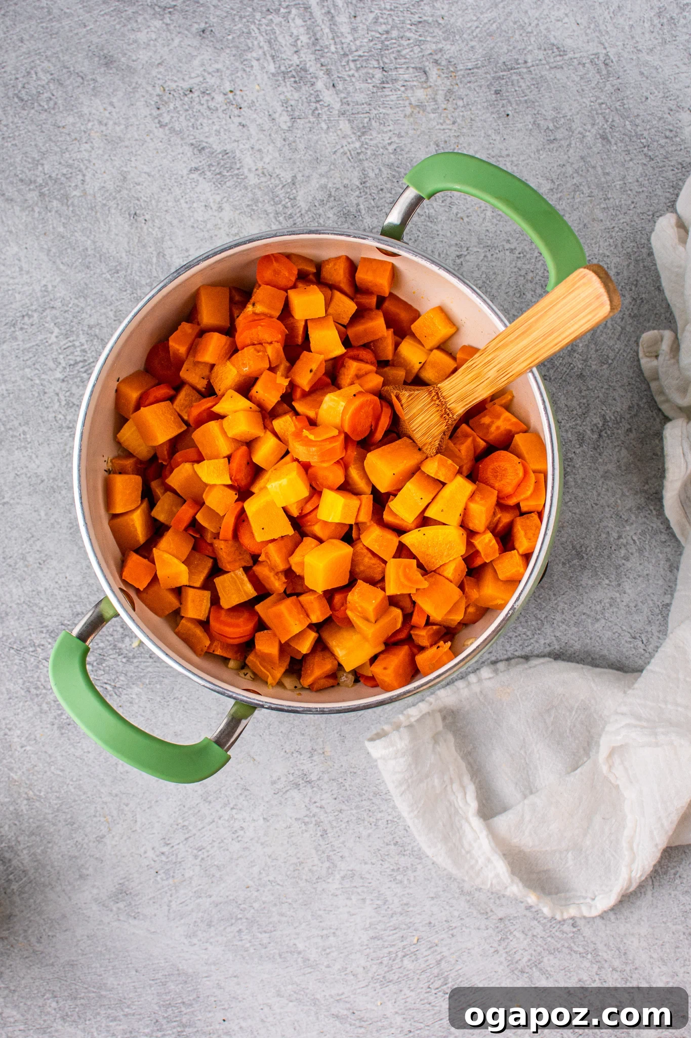 Autumn Gold Butternut and Sweet Potato Soup 6 Butternut Squash and Sweet Potato Soup with vegetables in pot.