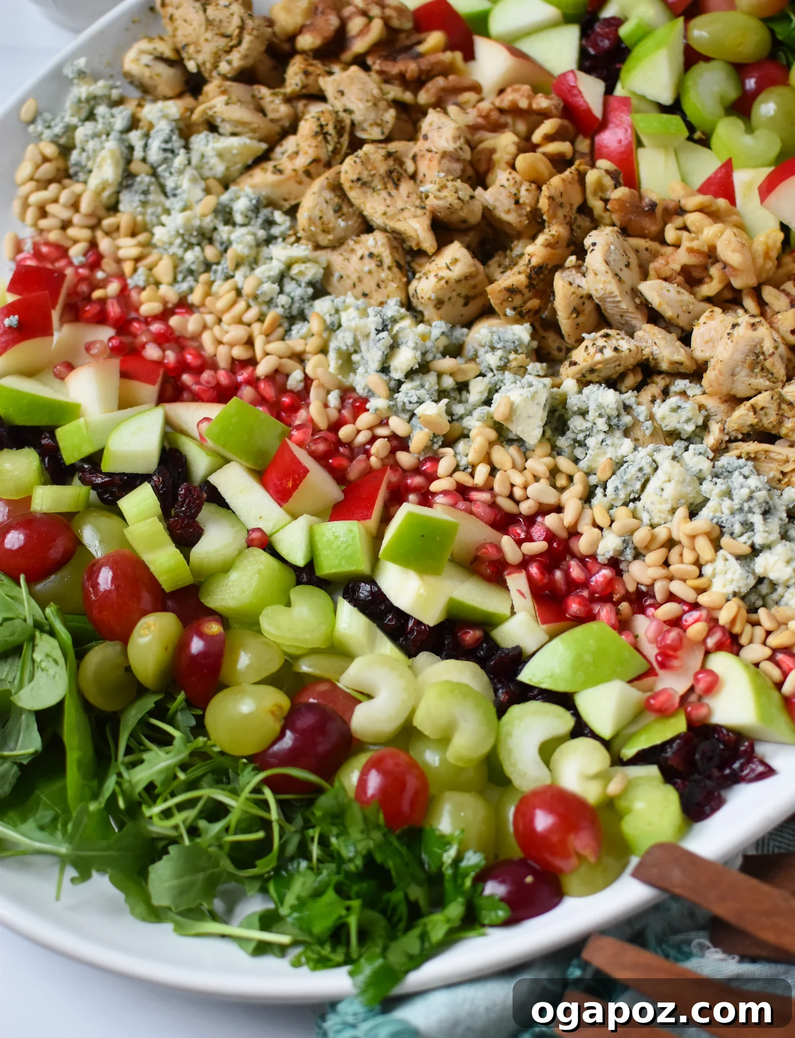 Crisp Apple and Walnut Waldorf Salad 2 Beautifully arranged Waldorf Salad with wooden serving forks, highlighting fresh ingredients.