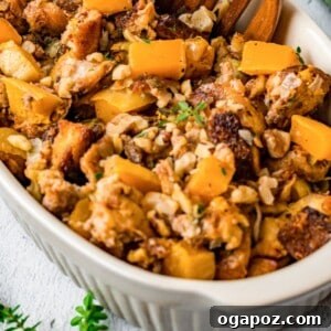 Sweet and Savory Butternut Squash Stuffing 6 Butternut Squash Stuffing served in a casserole dish, with a scoop removed.