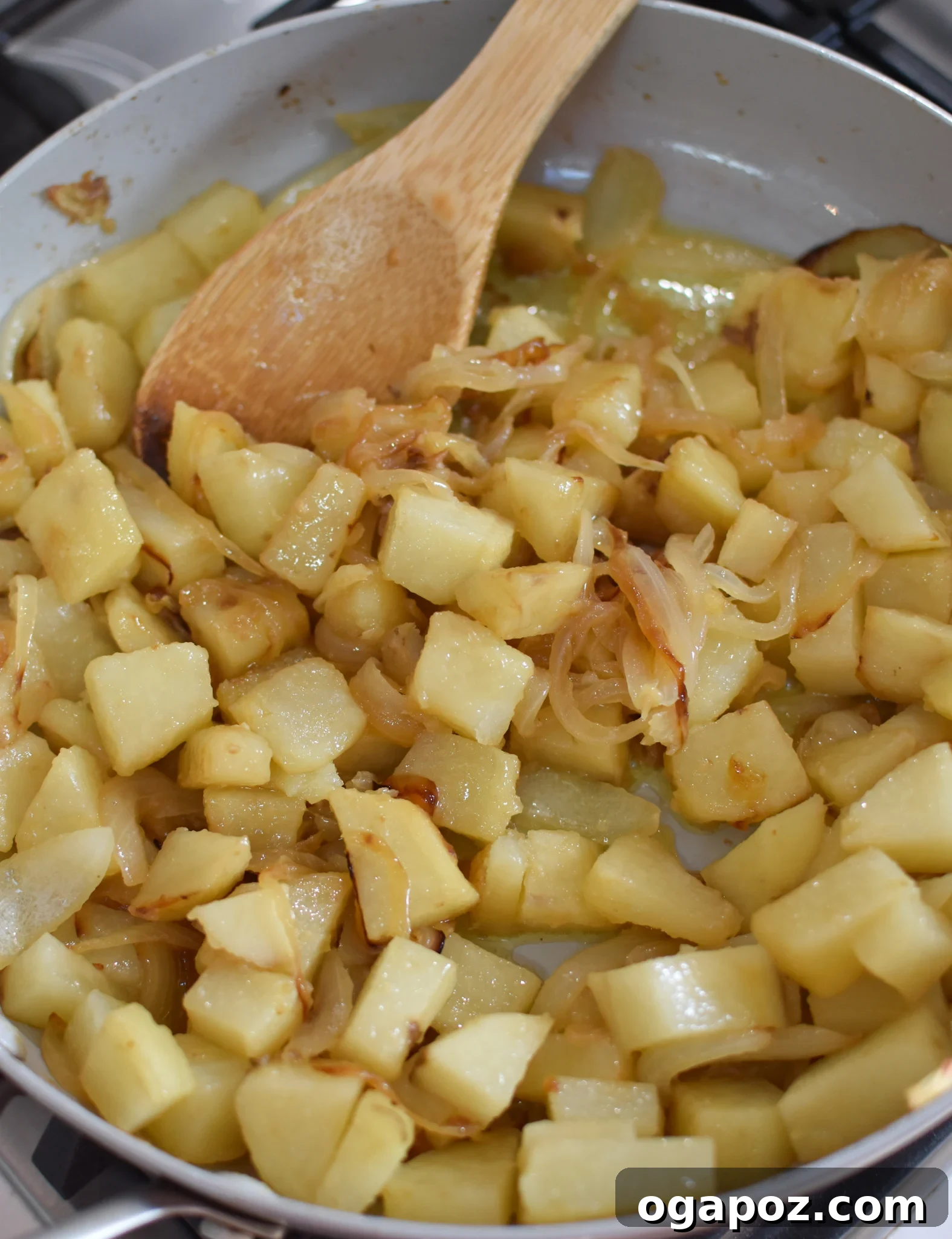 Savory Lebanese Potatoes and Eggs 8 Sautéed potatoes and onions in a skillet, nearly ready for the eggs.