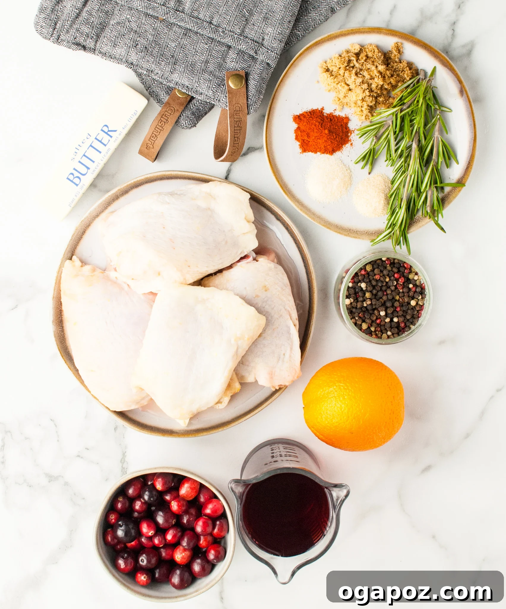 Effortless Cranberry Glazed Chicken Thighs 3 Fresh ingredients for Easy Baked Chicken Thighs, including cranberries, oranges, and spices.