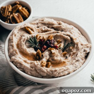 White Bean Hummus with Cranberry in a small serving bowl.