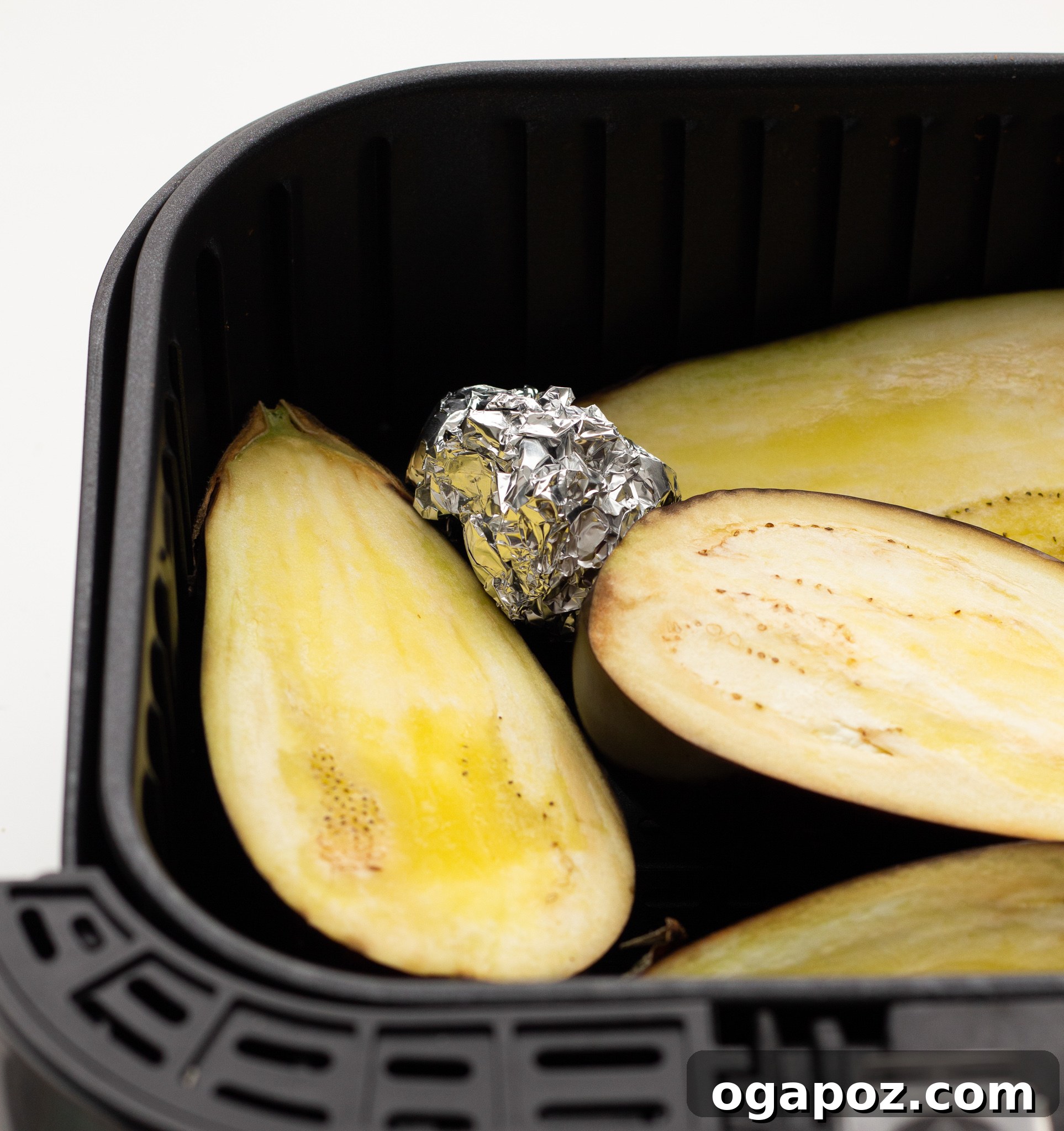 Crispy Air Fryer Eggplant 7 Air Fryer Eggplant with garlic in air fryer.