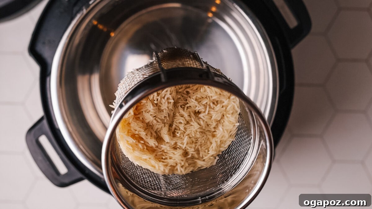 Foolproof Instant Pot Rice 4 Rinsing rice in a fine mesh strainer
