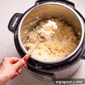 Instant Pot Rice with a serving spoon.