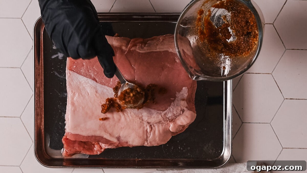 Perfect Air Fryer Pork Loin 5 Applying the seasoning mixture onto the pork loin.