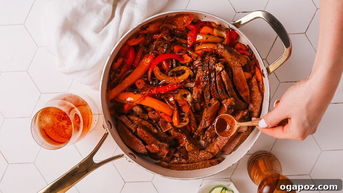 Ultimate Juicy Beef Fajitas 11 fajita on pan with colorful vegetables