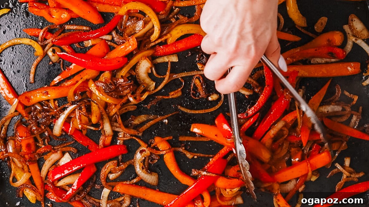 Ultimate Juicy Beef Fajitas 9 cooking veggies in a hot skillet
