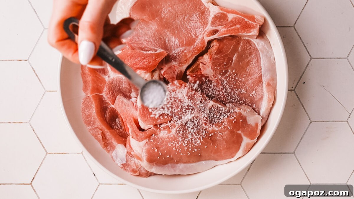 Fork Tender Instant Pot Pork Chops and Simple Gravy 4 Seasoning the pork chops generously with spices.
