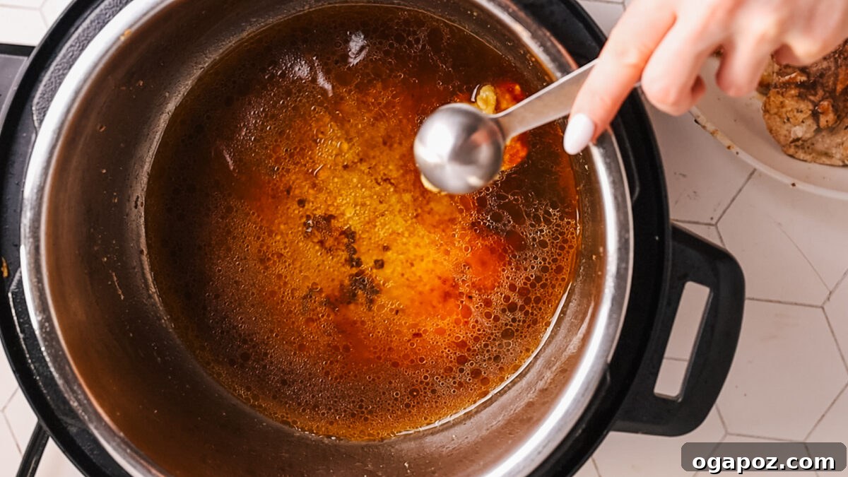 Fork Tender Instant Pot Pork Chops and Simple Gravy 8 Preparing the creamy gravy in the Instant Pot.