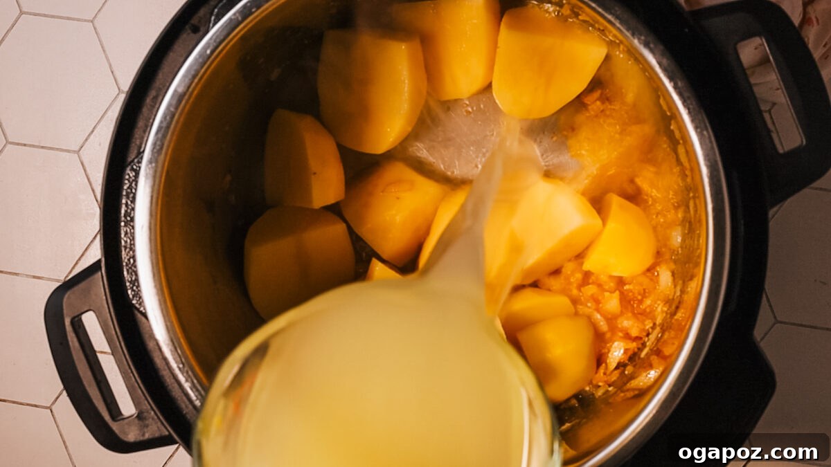 Effortless and Delicious Instant Pot Potato Soup 7 adding potato and broth