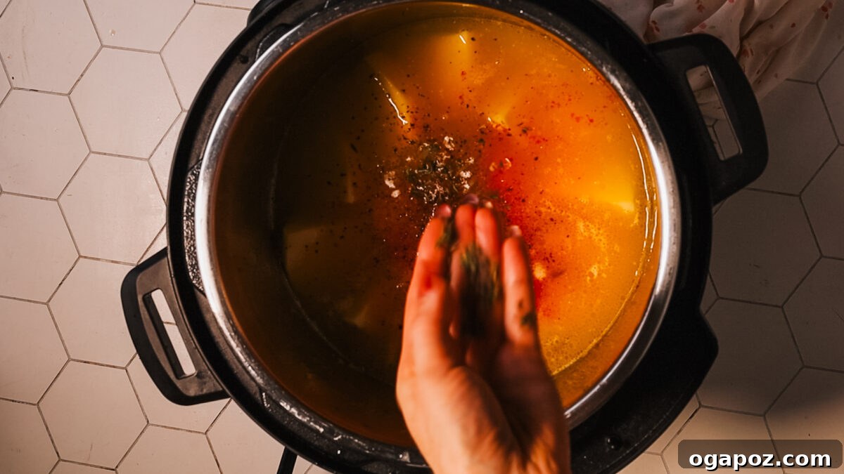 Effortless and Delicious Instant Pot Potato Soup 8 adding seasoning in pot