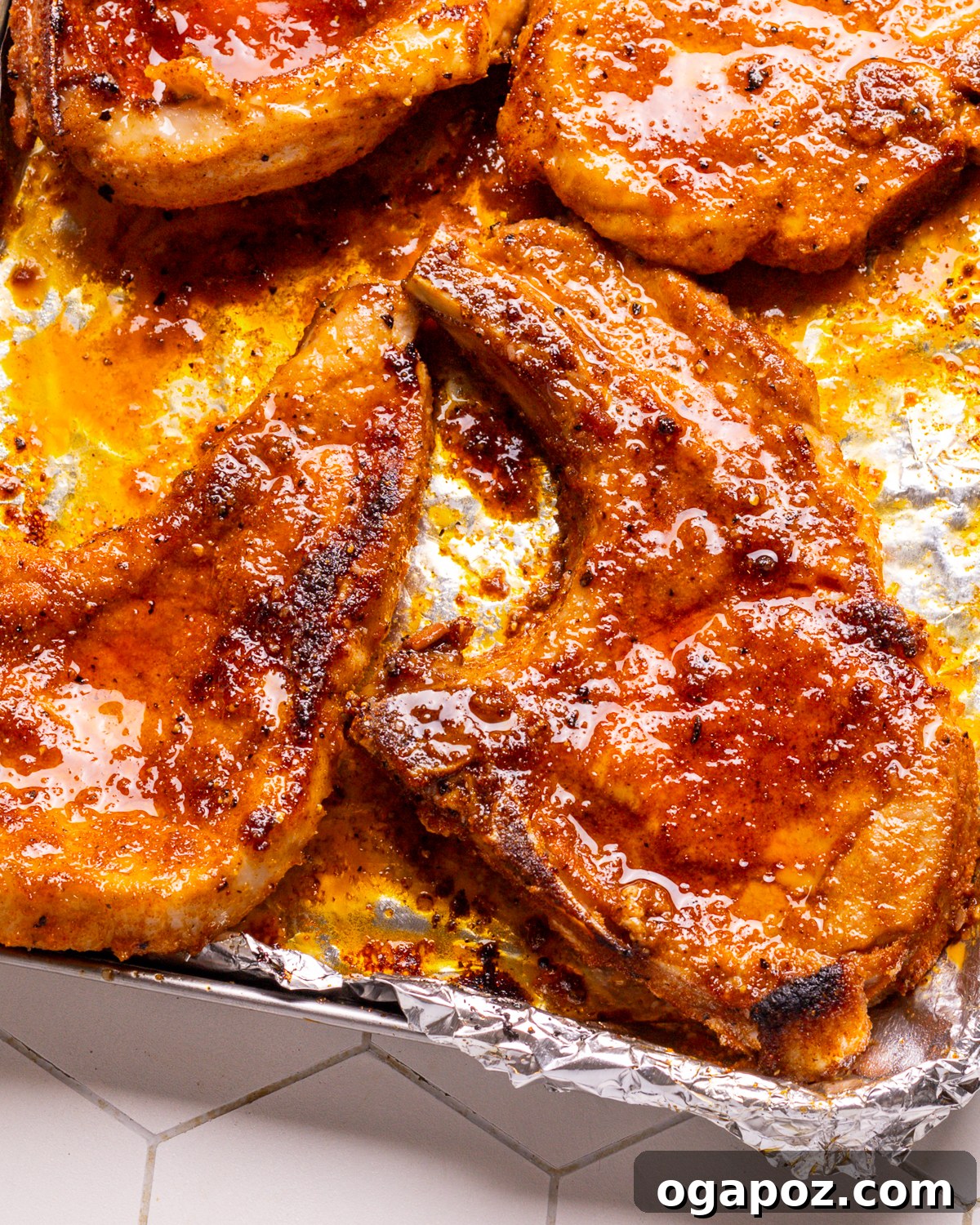 Baked Pork Chops on a Foil-Lined Baking Sheet.