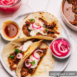 Shredded Beef Tacos, piled high with tender meat and fresh toppings.