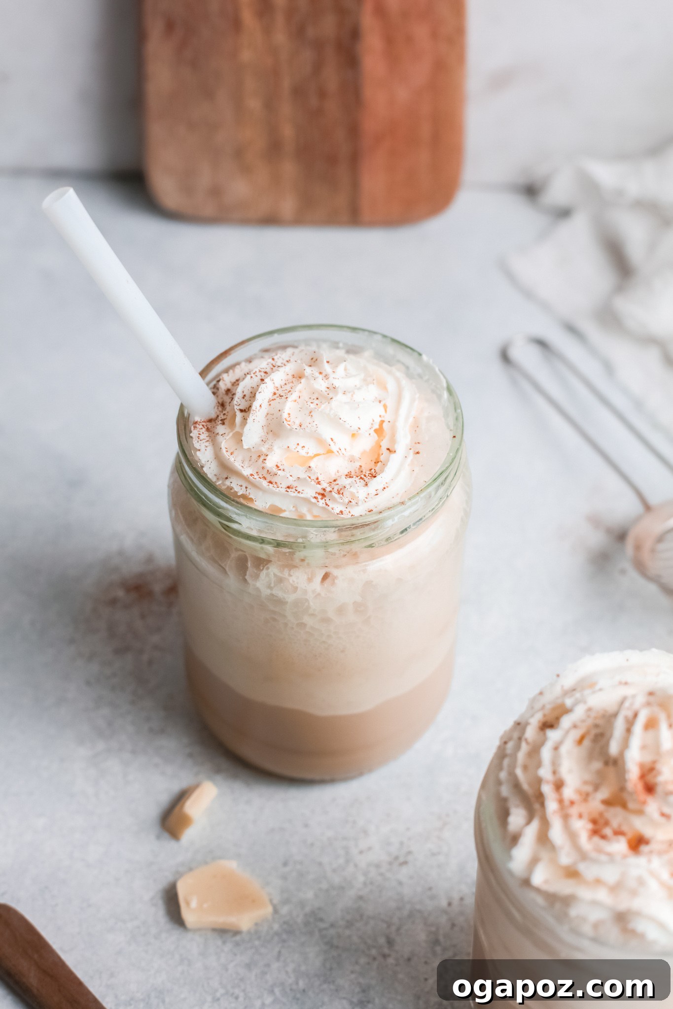 Velvet White Mocha Freeze 4 Single White Chocolate Frappuccino in a glass cup with a straw.