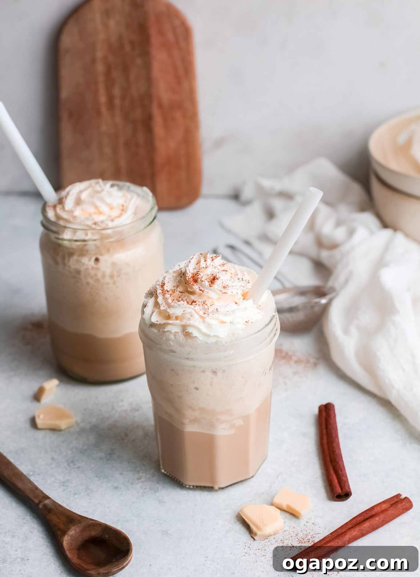 Velvet White Mocha Freeze 7 Two glasses of White Chocolate Frappuccino, topped with whipped cream and straws.