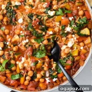 Mediterranean Orzo Pasta Recipe in a decorative bowl with a lemon wedge and fresh parsley