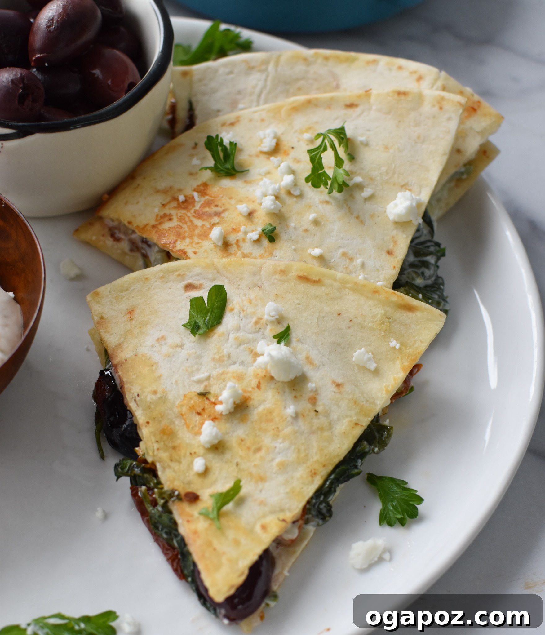 Easy Vegetarian Quesadilla Recipe topped with crumbled feta cheese