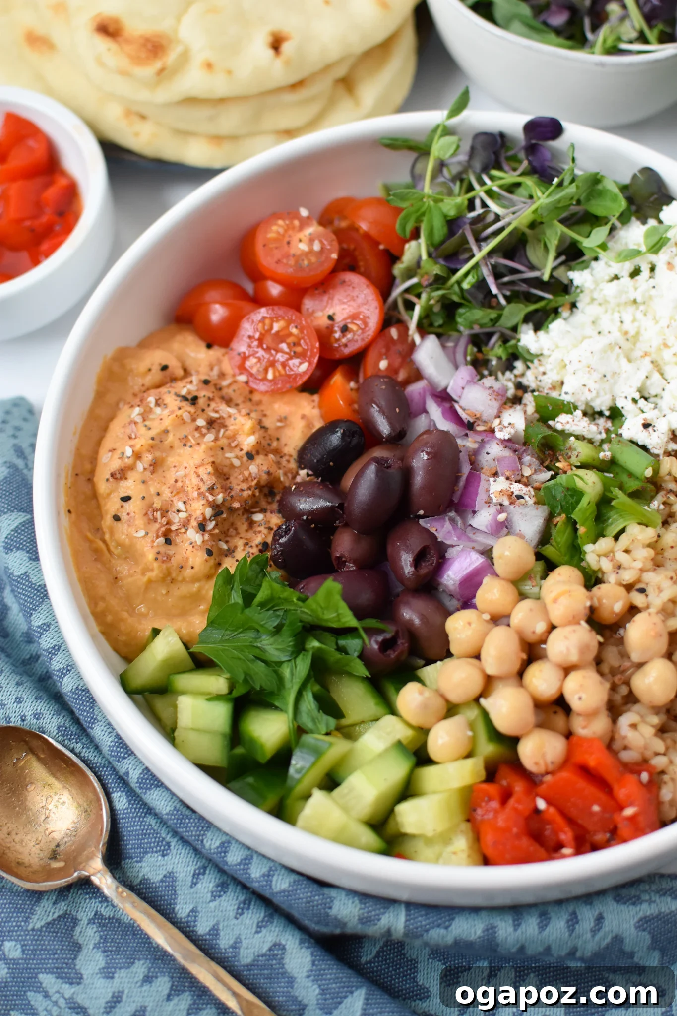 Vibrant Mediterranean Hummus Bowl 2 A beautifully arranged Easy Mediterranean Hummus Bowl in a white bowl, showcasing all its colorful ingredients.