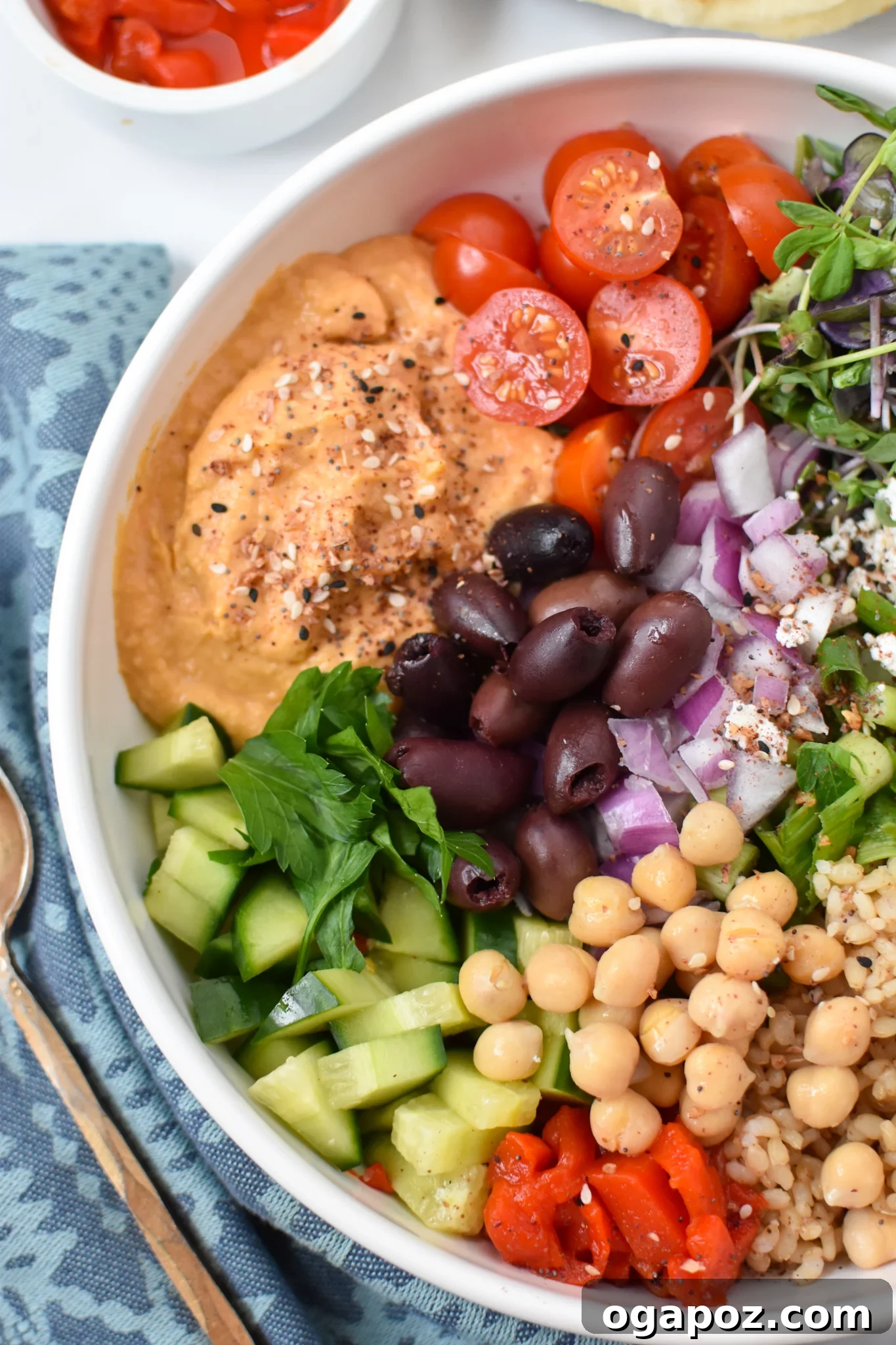 Vibrant Mediterranean Hummus Bowl 5 Easy Mediterranean Hummus Bowl with focus on fresh tomatoes and greens.