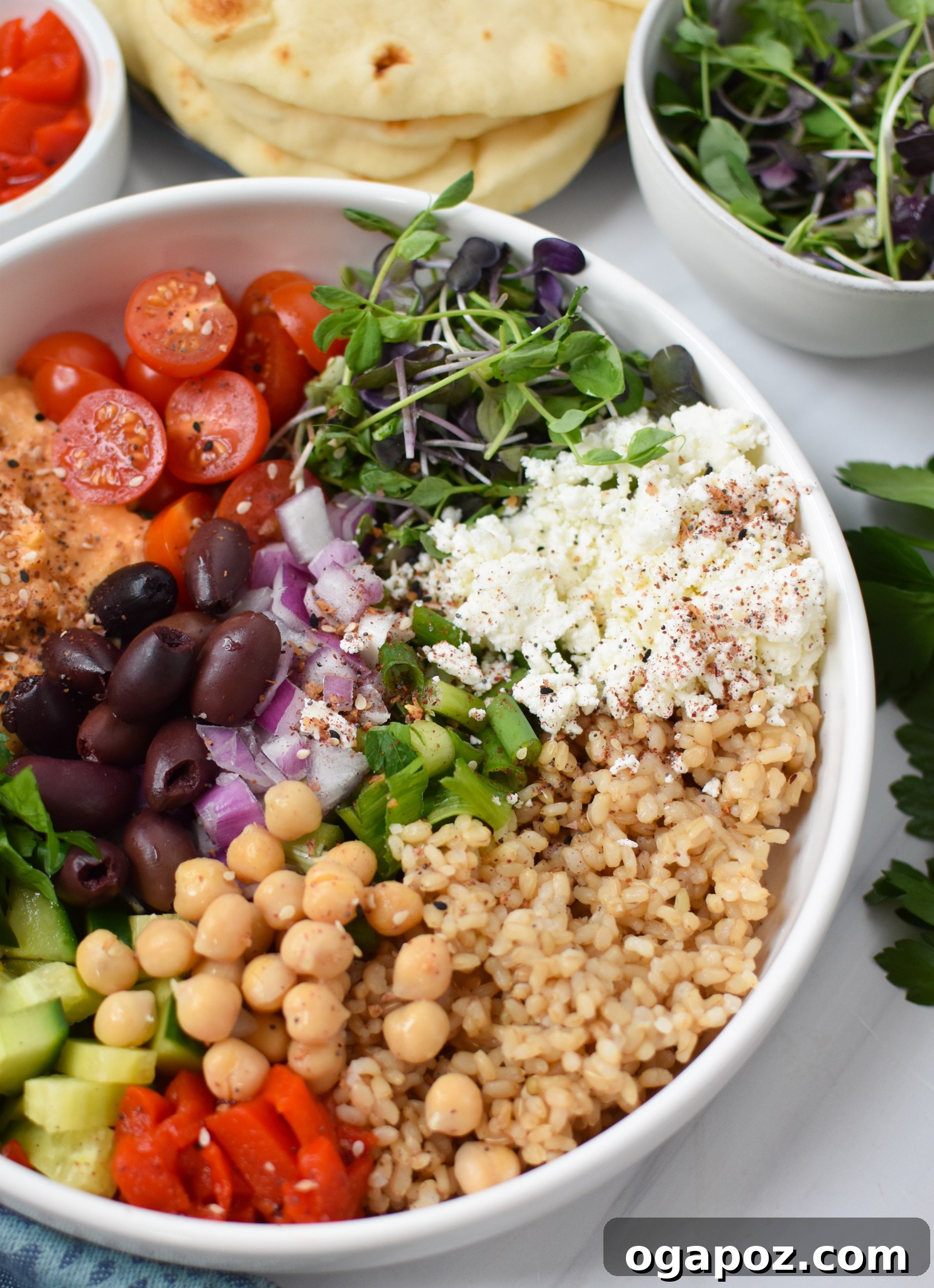 Vibrant Mediterranean Hummus Bowl 6 An Easy Mediterranean Hummus Bowl garnished with generous feta cheese and fresh herbs.