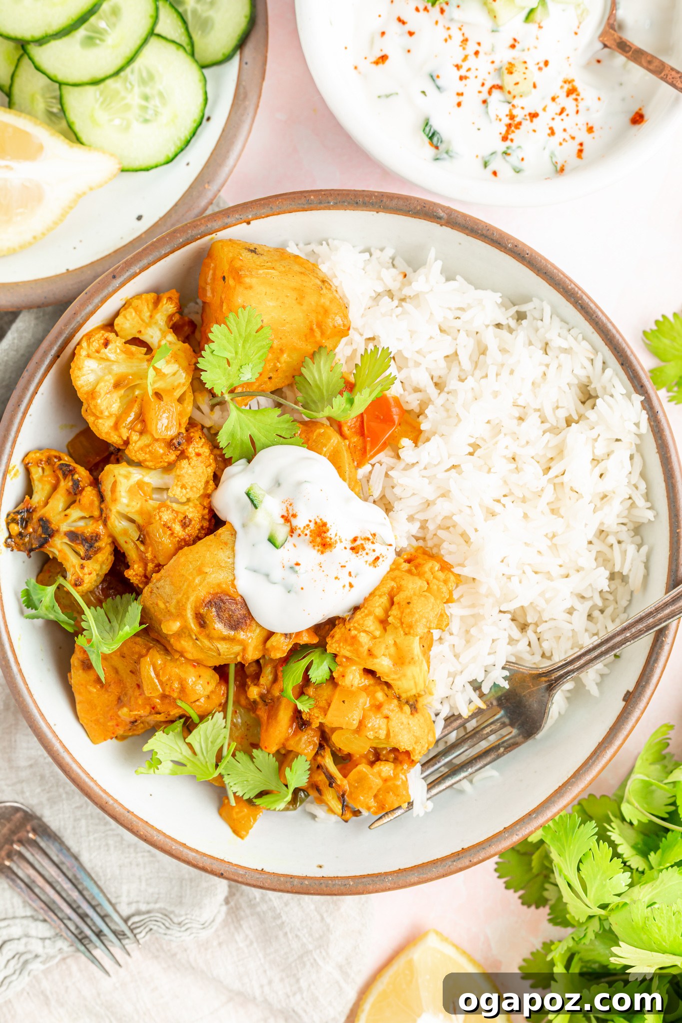 Cauliflower Curry Recipe with yogurt, garnished with fresh cilantro.