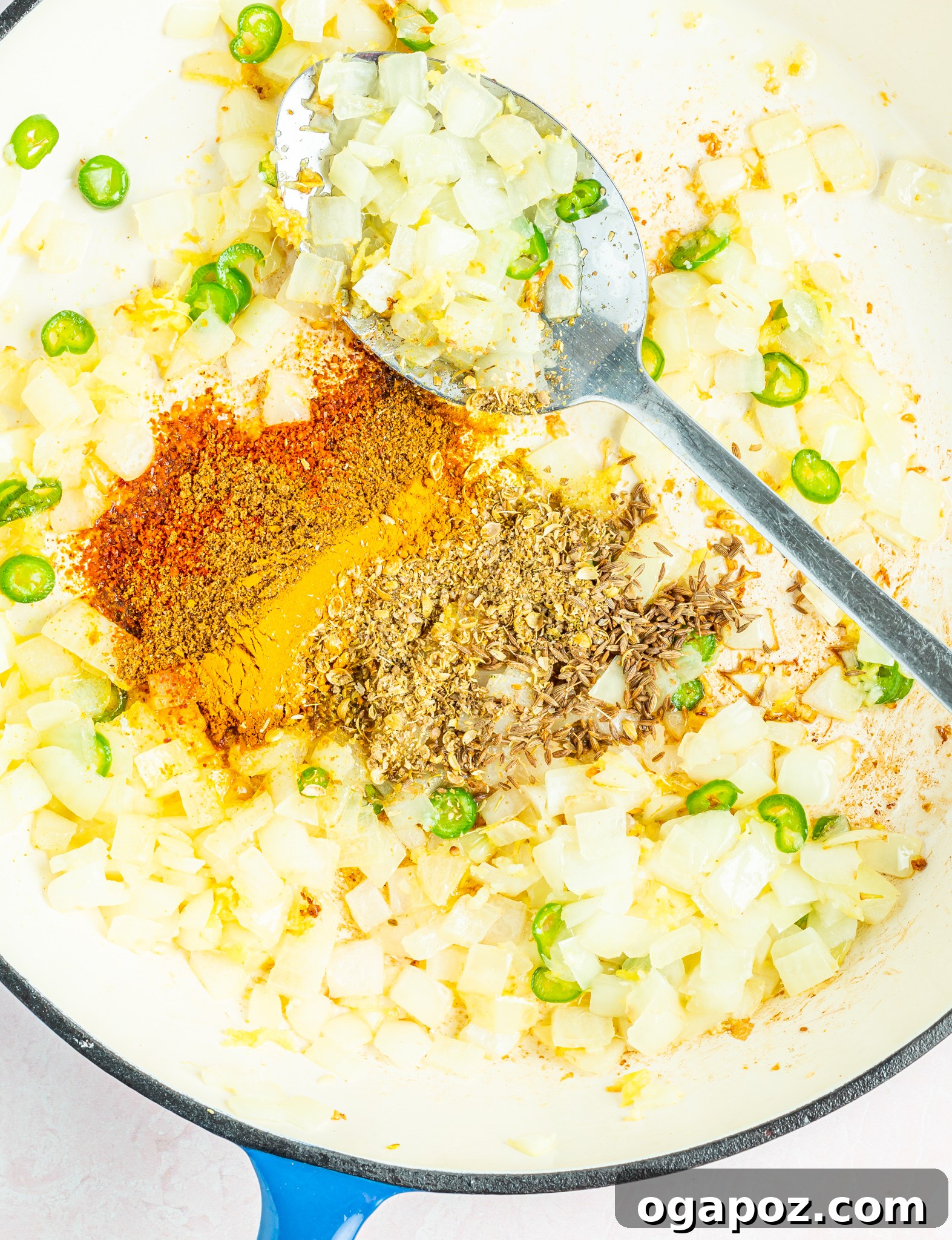 Cauliflower Curry Recipe with tomatoes in a skillet.
