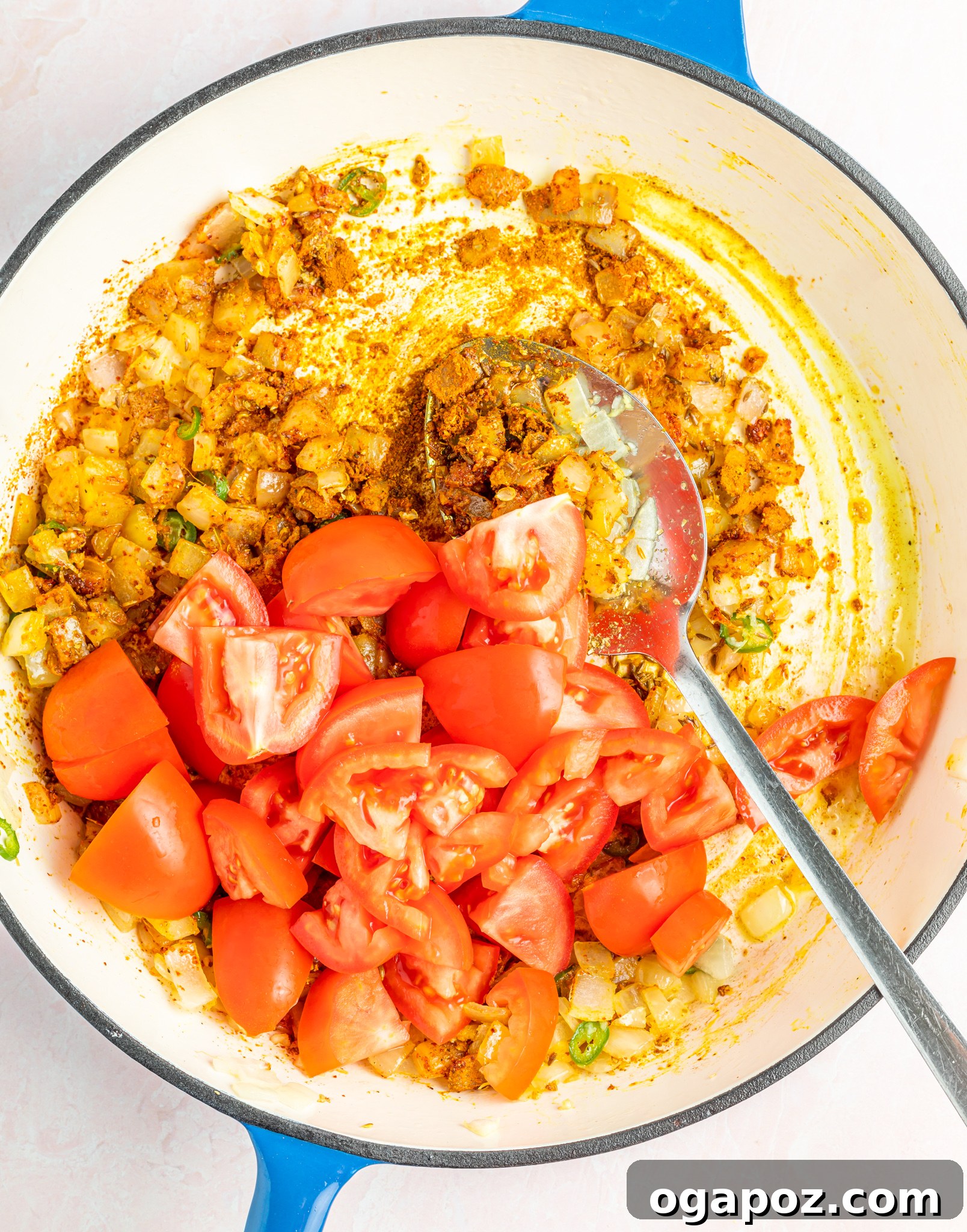 Cauliflower Curry Recipe with tomatoes and broth added to the sauce.
