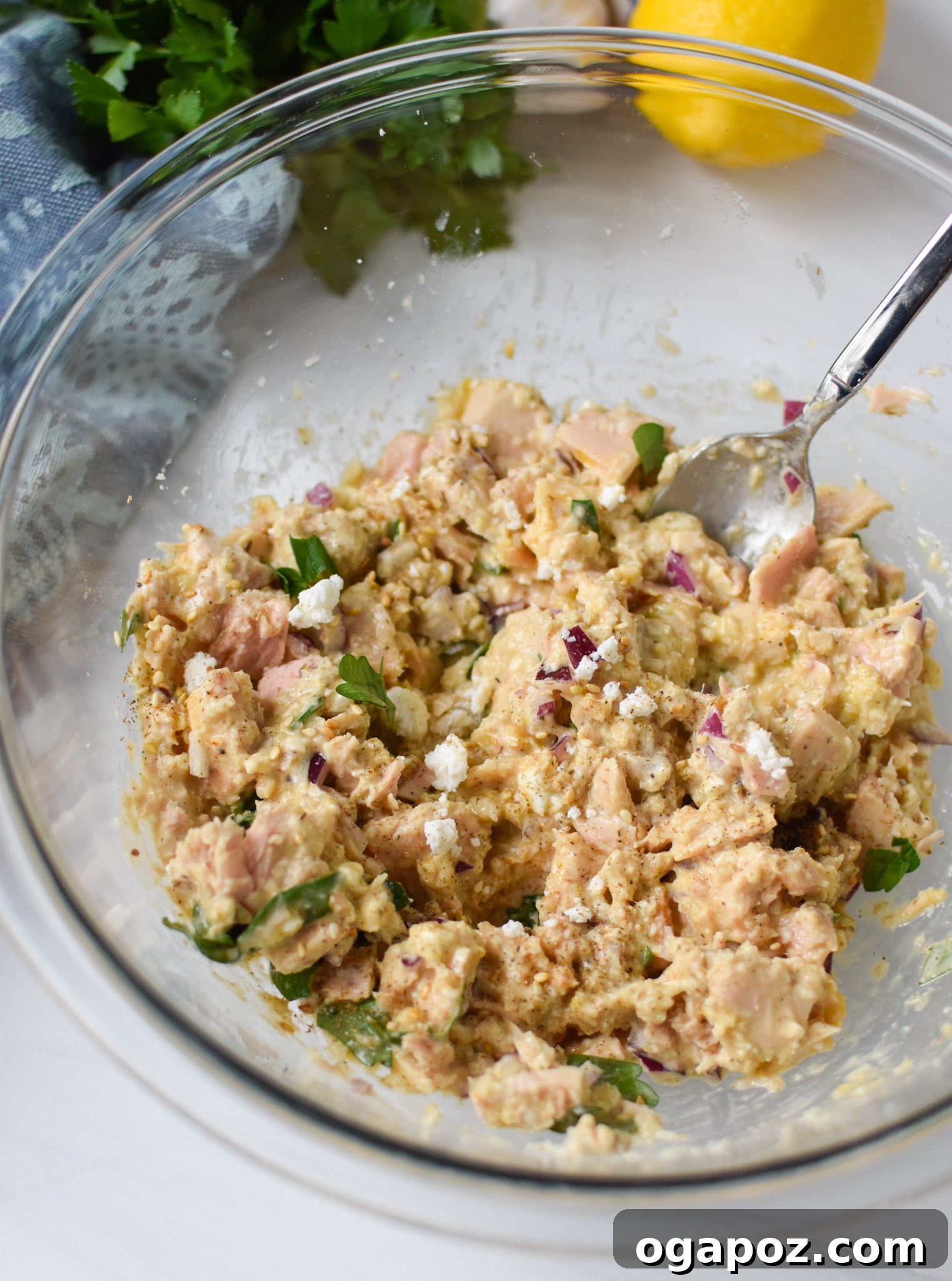 Zesty Mediterranean Tuna Fritters 6 Mediterranean Tuna Patties Recipe tuna mixture combined in a bowl.