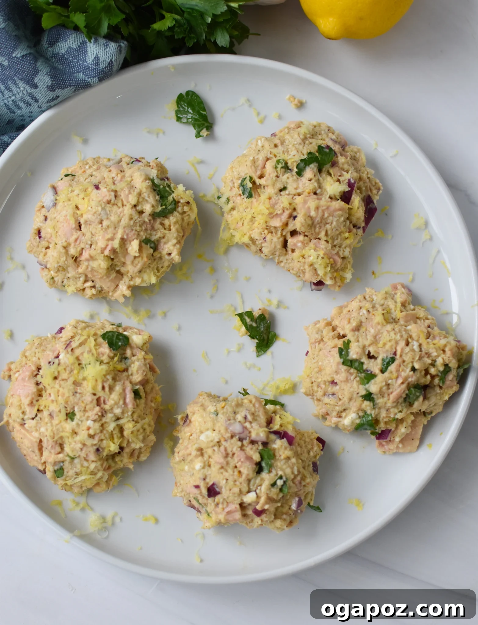 Zesty Mediterranean Tuna Fritters 7 Mediterranean Tuna Patties Recipe tuna cakes formed and ready for breading.