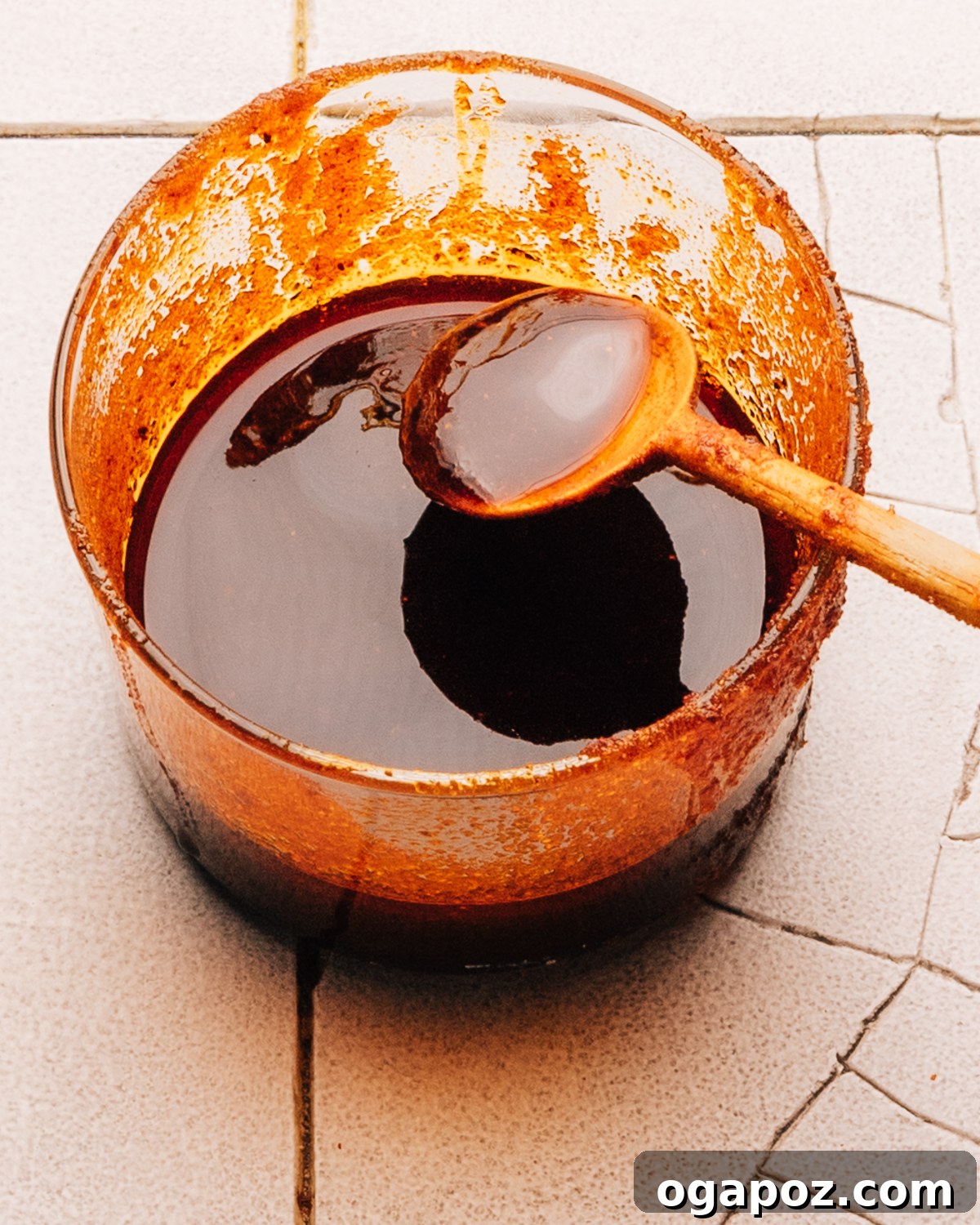 Step 3: The Nashville hot sauce is mixed with a whisk, showing its rich, thick consistency.