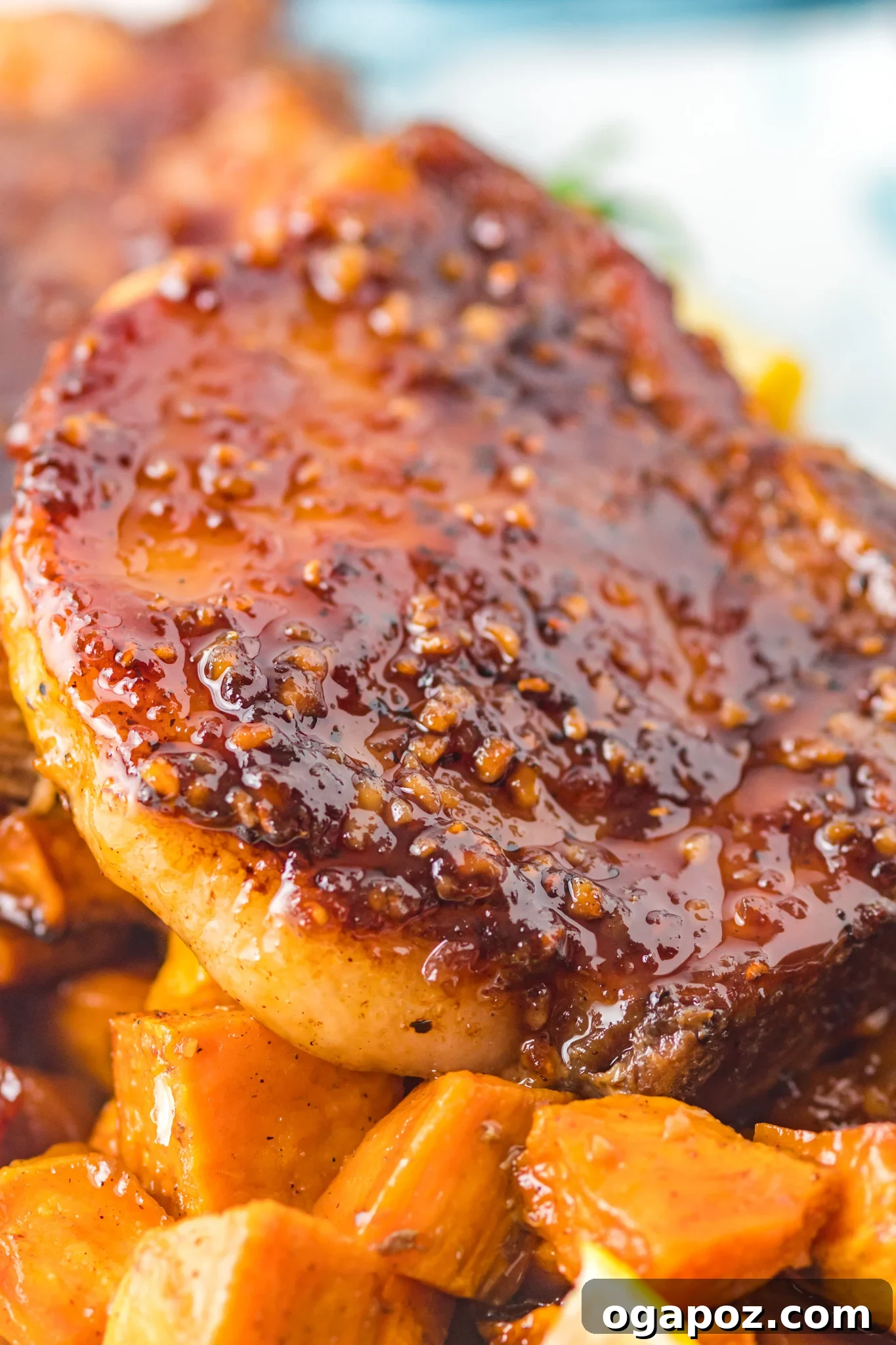 Close-up of Maple Bourbon Pork Chops Recipe with glaze dripping.