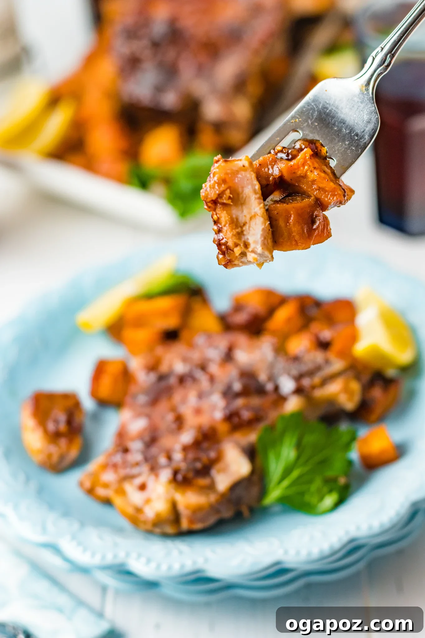 A piece of Maple Bourbon Pork Chops on a fork.