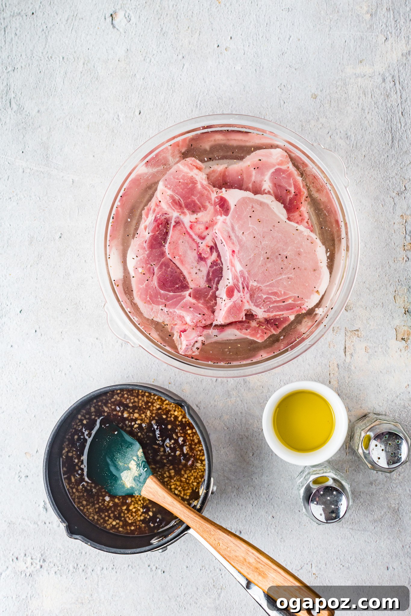 Maple Bourbon Pork Chops Recipe pork chops in a bowl for brining.