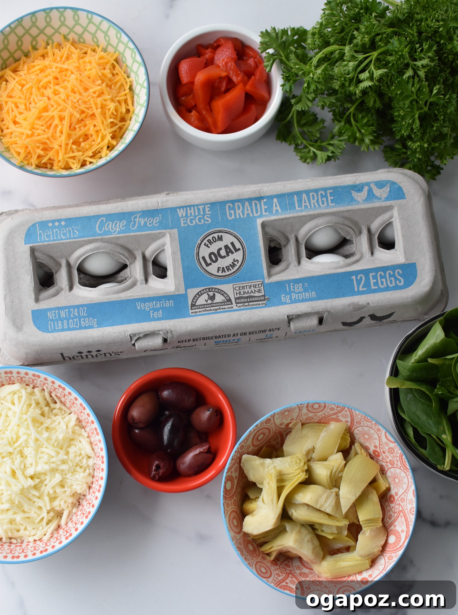 Close-up of Mediterranean Vegetable Frittata Recipe ingredients laid out on a board.
