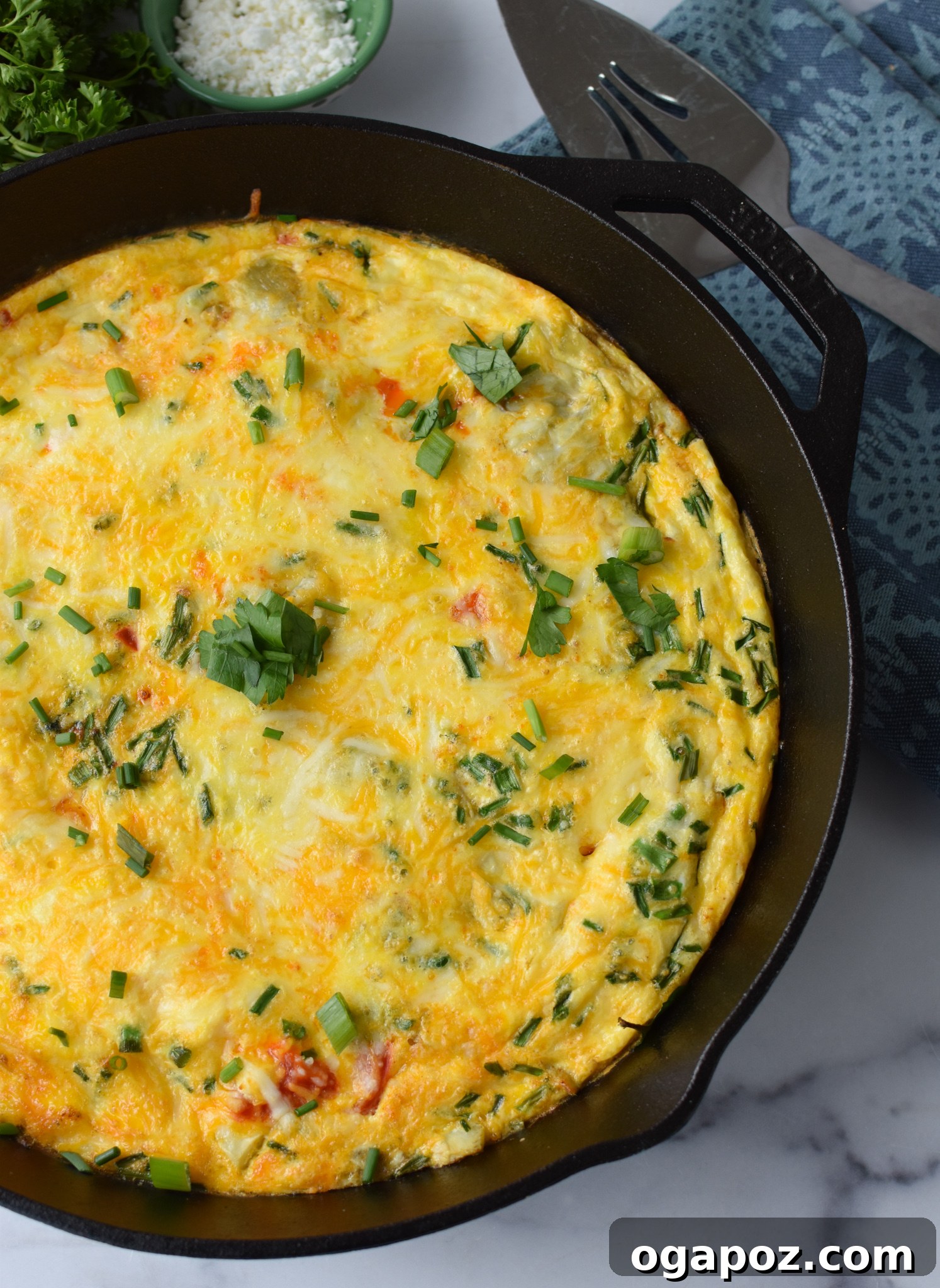 Mediterranean Vegetable Frittata Recipe garnished with fresh parsley.