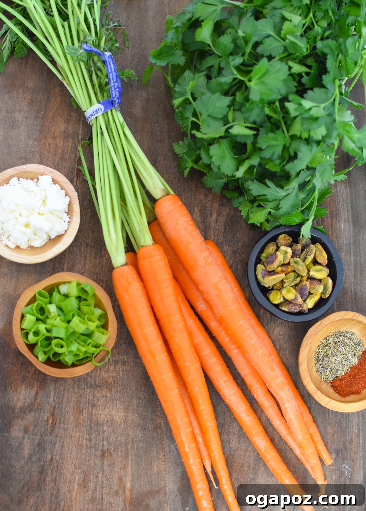 Golden Roasted Carrots with Crunchy Pistachios 3 Roasted Carrots with Pistachios ingredients laid out on a table.