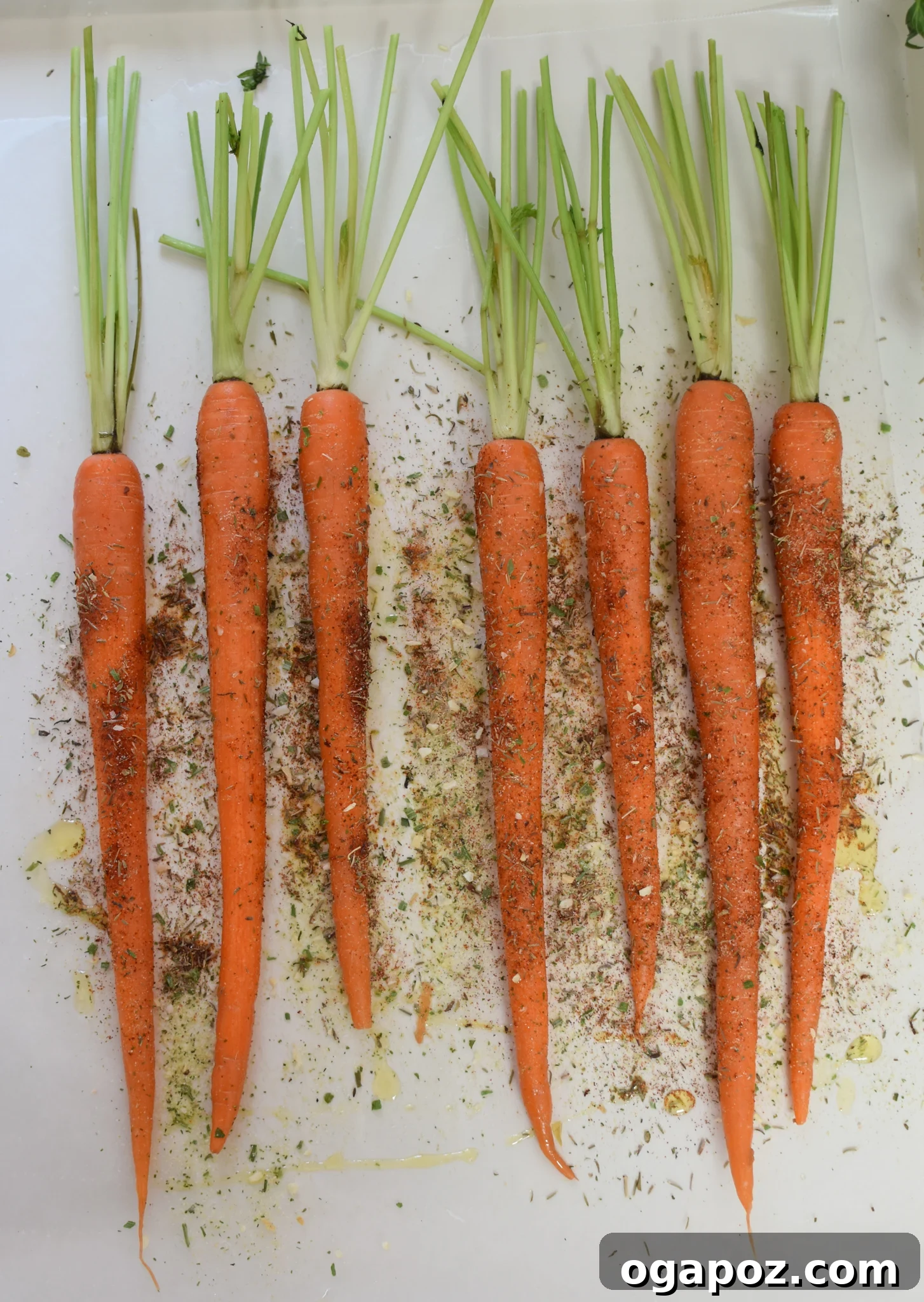 Golden Roasted Carrots with Crunchy Pistachios 5 Roasted Carrots with Pistachios before roasting, spread on a baking sheet.