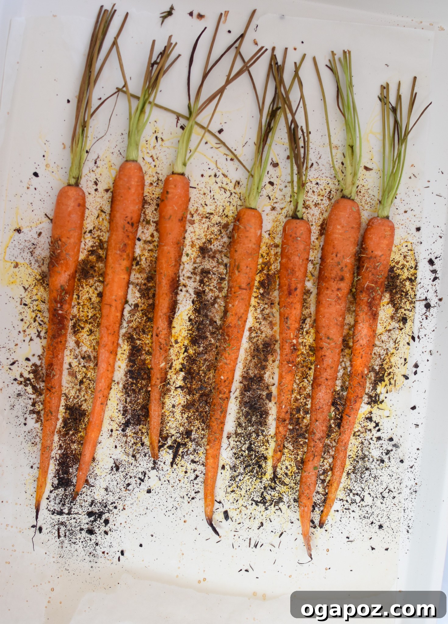 Golden Roasted Carrots with Crunchy Pistachios 6 Close-up of roasted carrots cooling on a baking sheet, ready for garnishing.