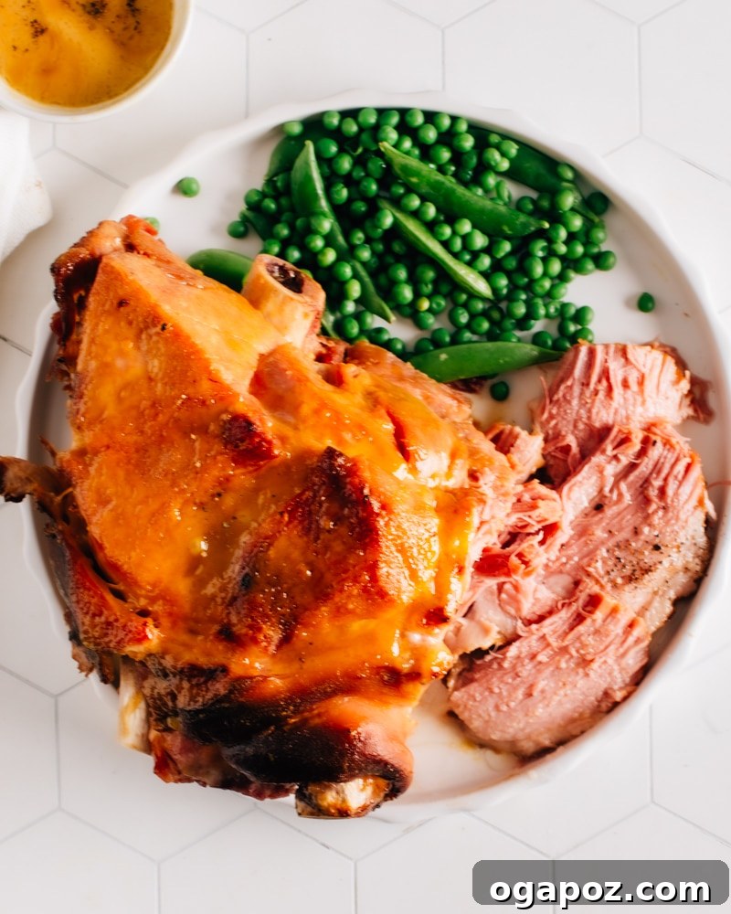 Elevate Your Easter Feast 12 Pressure cooker ham served on a plate with green vegetables.