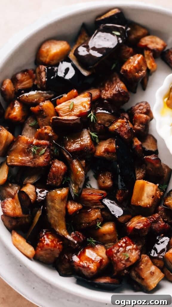 Elevate Your Easter Feast 31 Air fryer eggplant on a plate with a dip on the side.