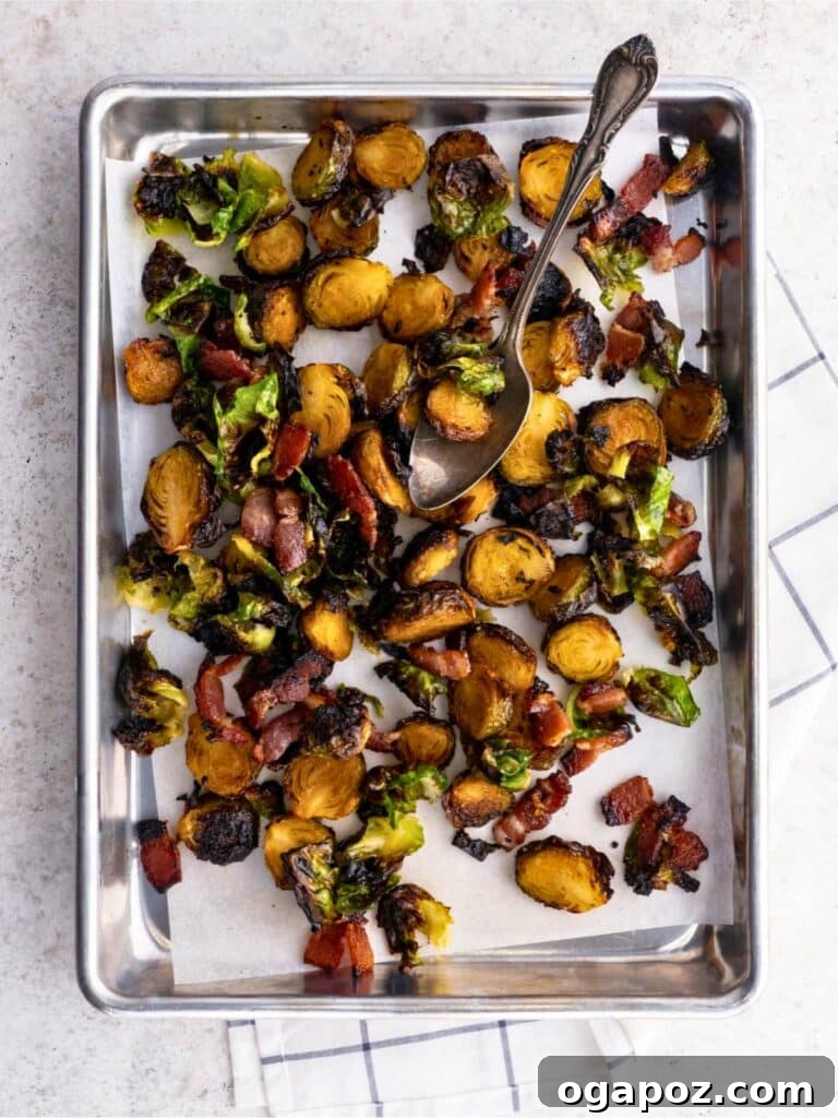 Elevate Your Easter Feast 34 Crispy Roasted Brussels Sprouts with Maple and Bacon on a baking sheet with parchment paper.