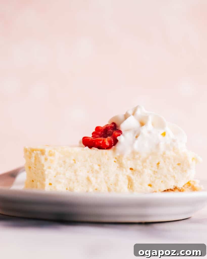 Elevate Your Easter Feast 46 Philadelphia cheesecake with whipped cream and raspberry.