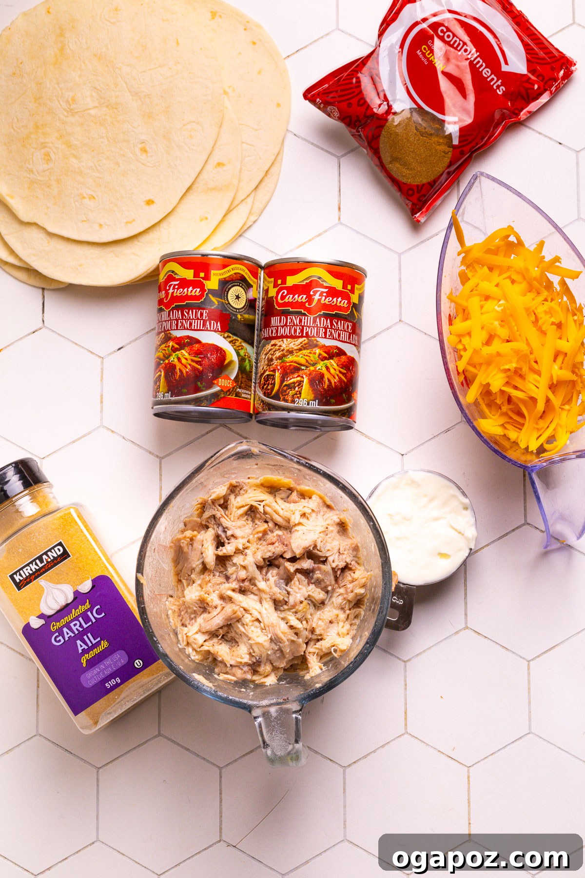Creamy Chicken Enchilada Bake 3 Enchilada Casserole Ingredients laid out on a kitchen counter, showcasing fresh and pantry staples.