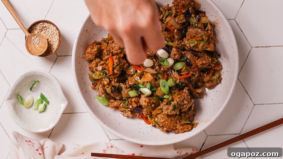 15 Minute Savory Egg Roll Bowl 10 garnishing with spring onion