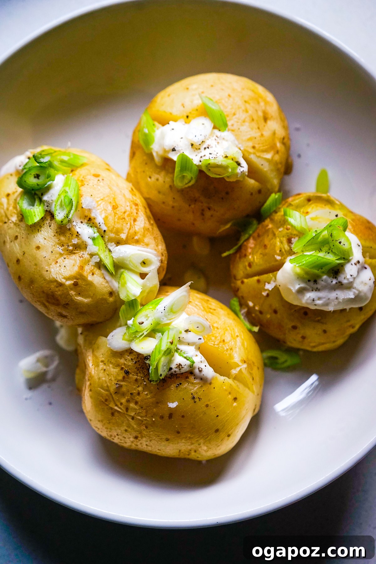 Microwave Baked Potatoes served in a plate with butter