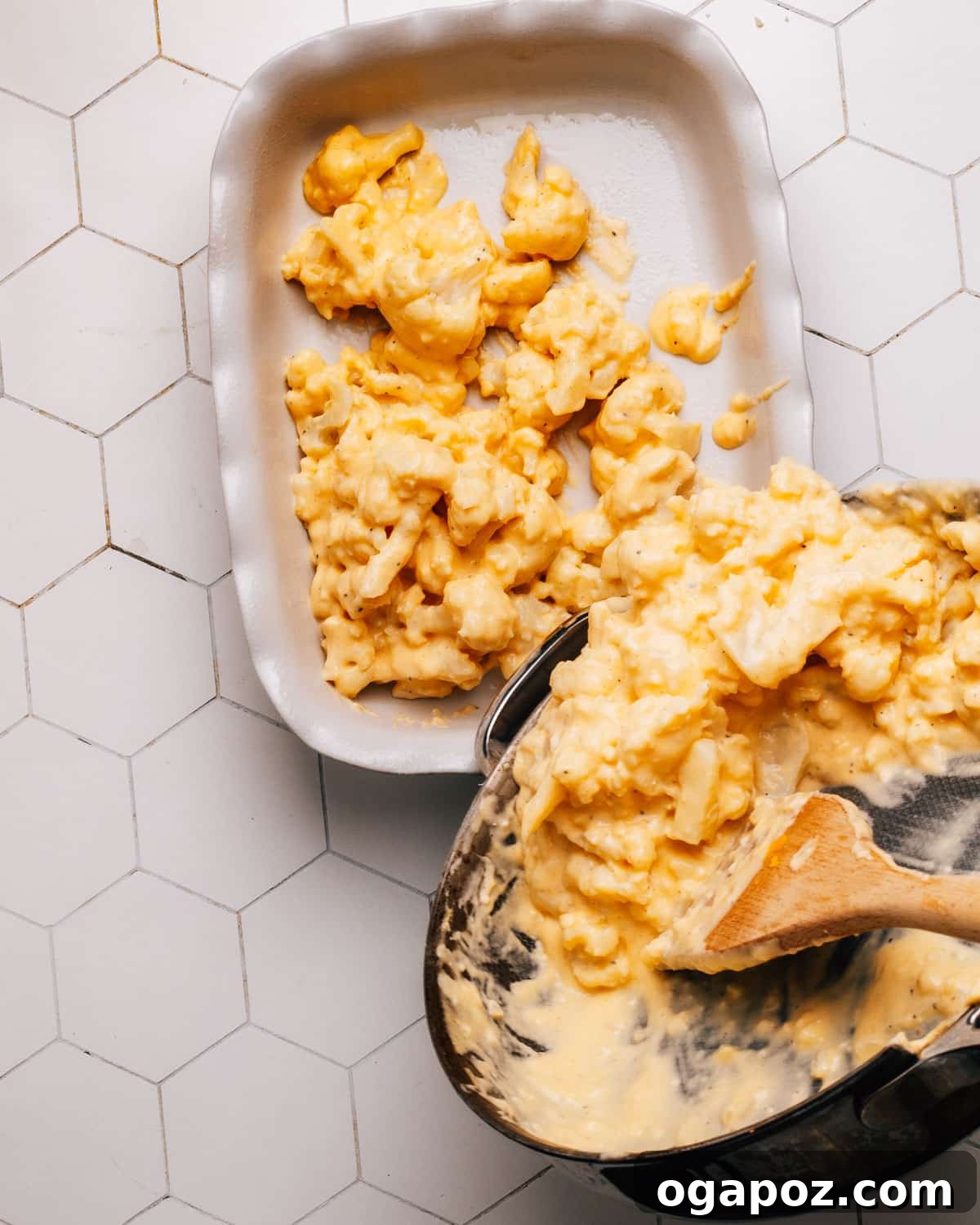 A close-up of panko breadcrumbs mixed with melted butter and grated cheddar cheese, forming the crunchy topping.