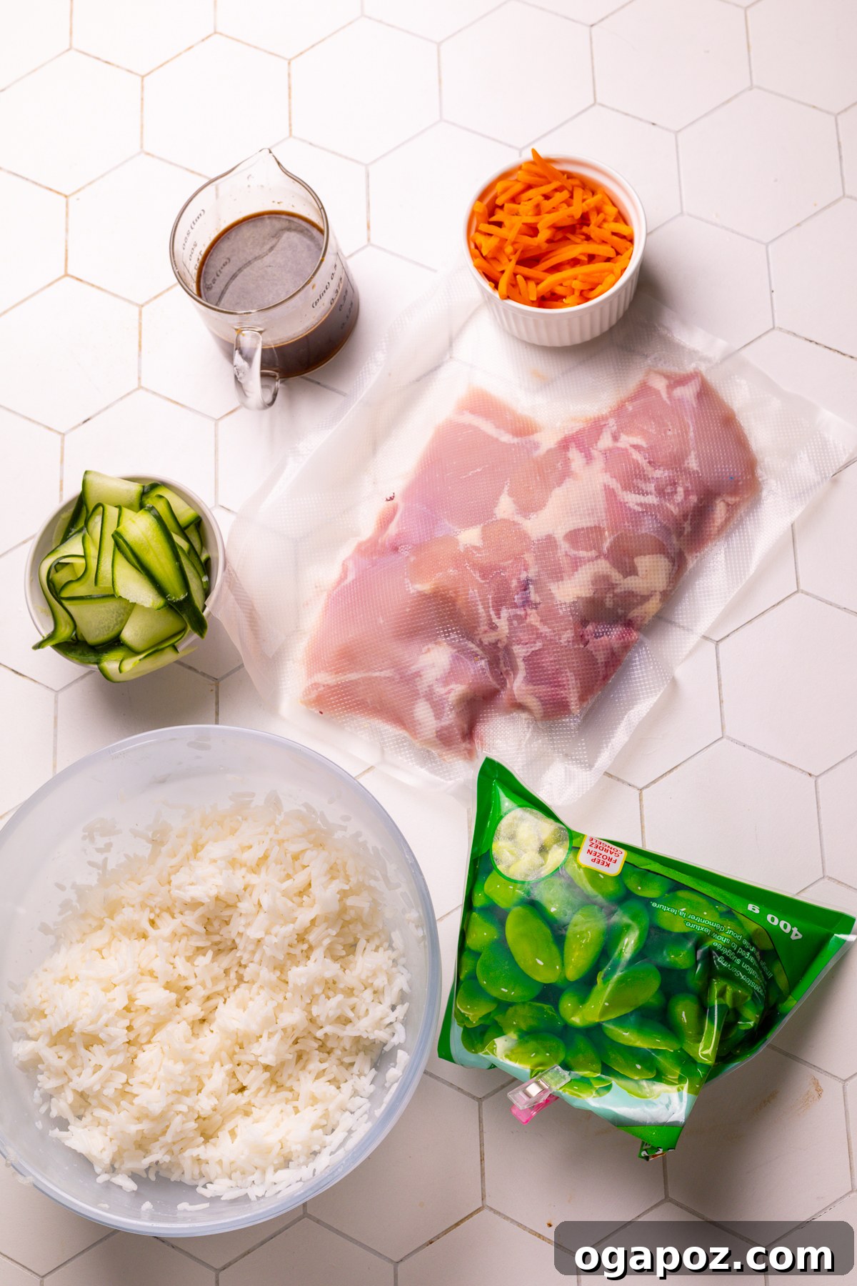 Delicious 30-Minute Teriyaki Bowl 3 A flat lay image showing all the fresh ingredients required for a teriyaki bowl, including chicken, sauces, and various vegetables.