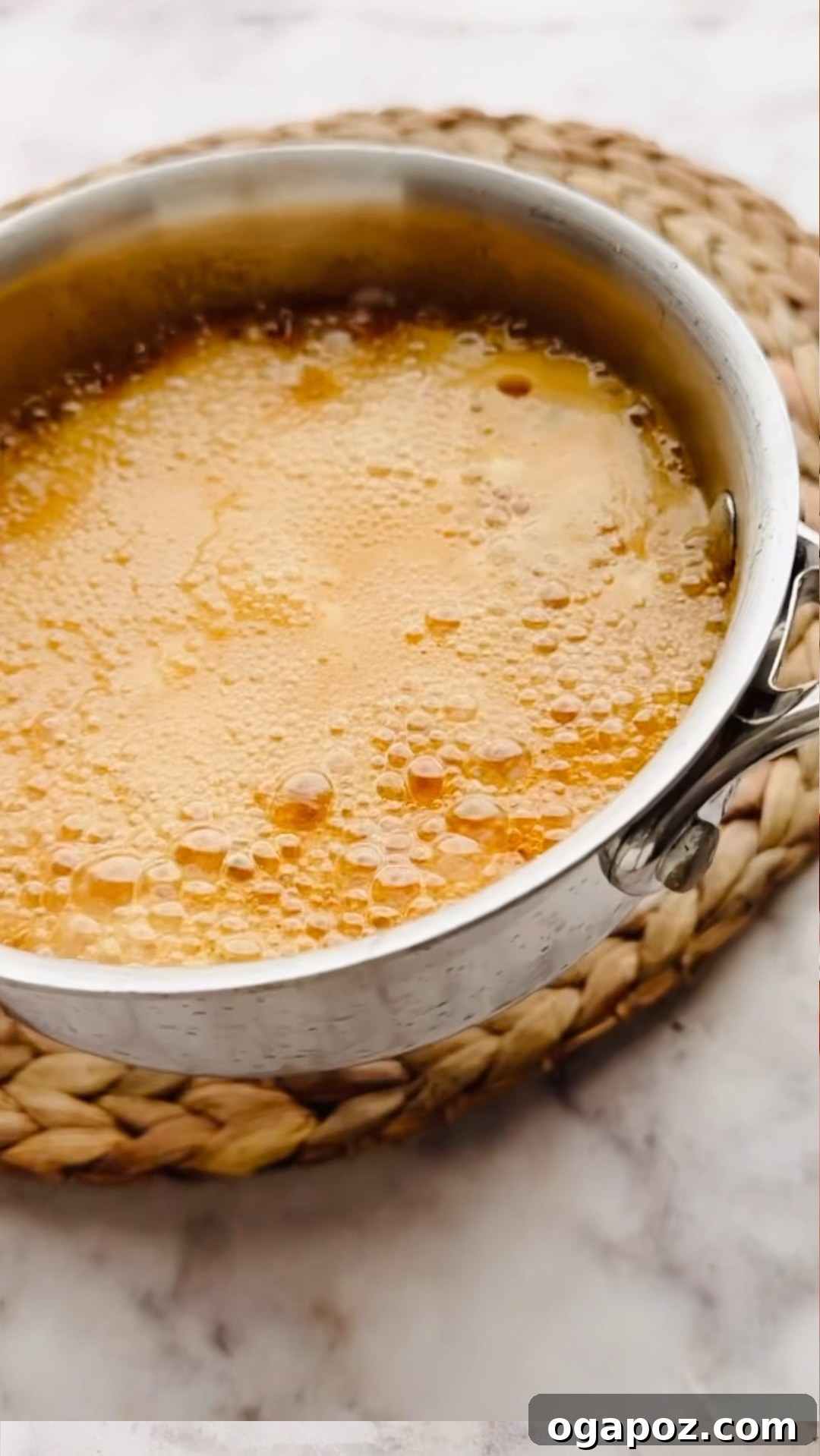 Fiery Honey Drizzle 5 Step 2: Hot honey sauce simmering in a saucepan.
