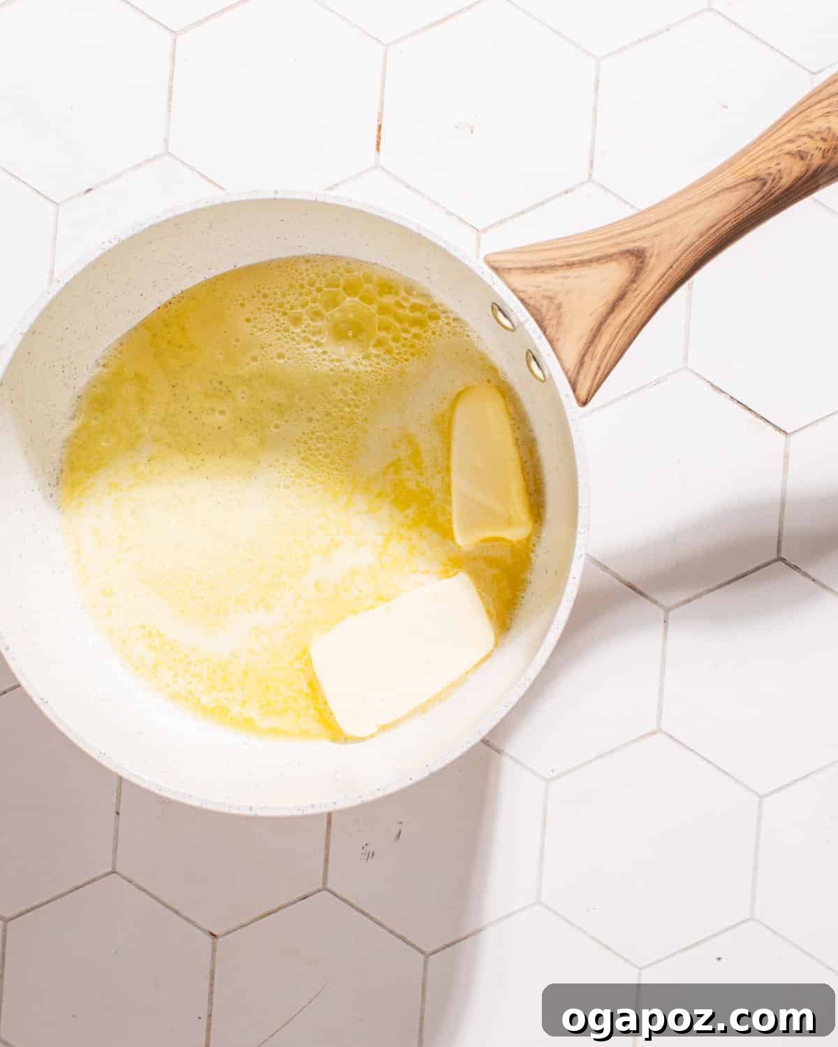 Bold Garlic Parmesan Sauce 3 Collection of fresh ingredients for garlic parmesan sauce, including butter, garlic, milk, flour, and parmesan cheese.